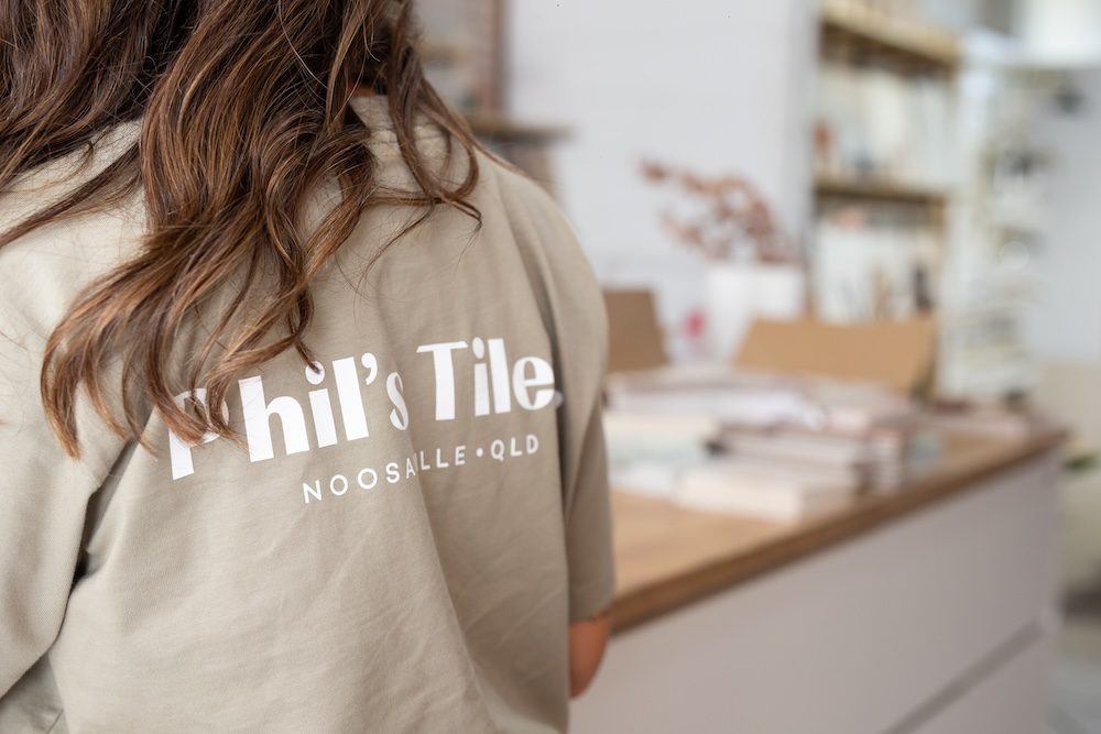A Phil's Tiles team member at the showroom counter