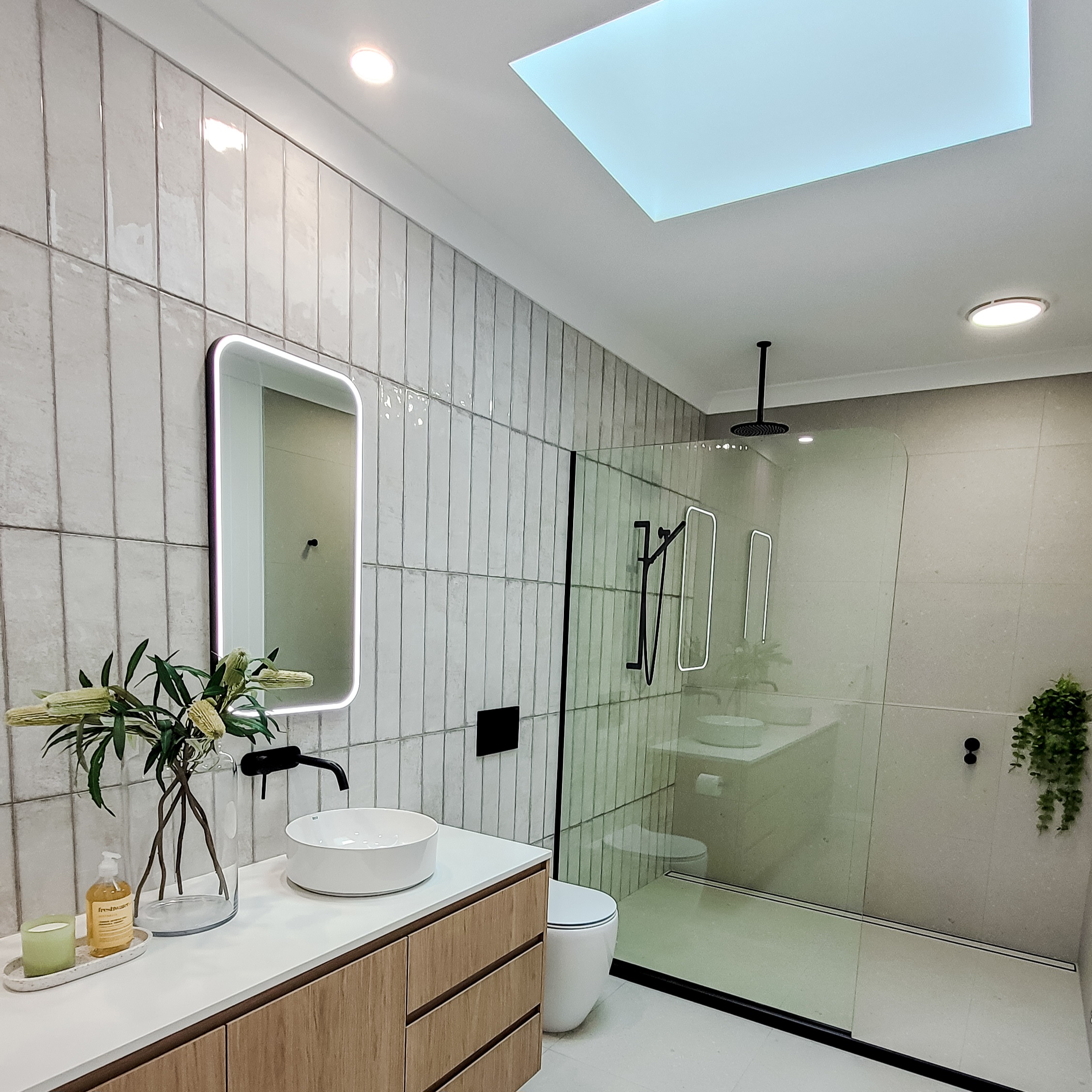 Ensuite with vertical stack concrete-look tiles and walk-in shower